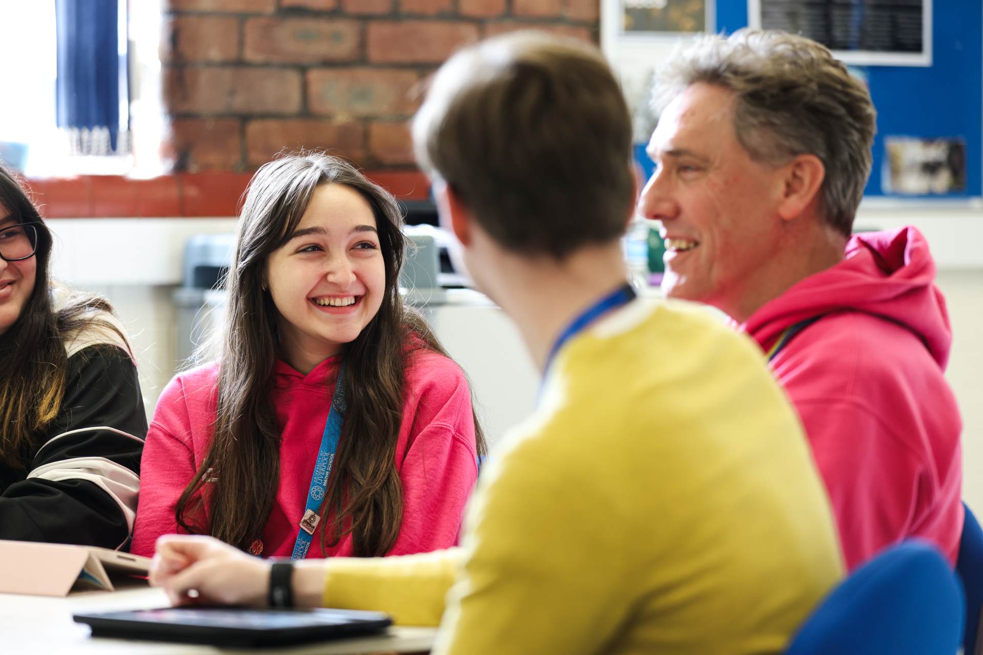 Students talking to a teacher